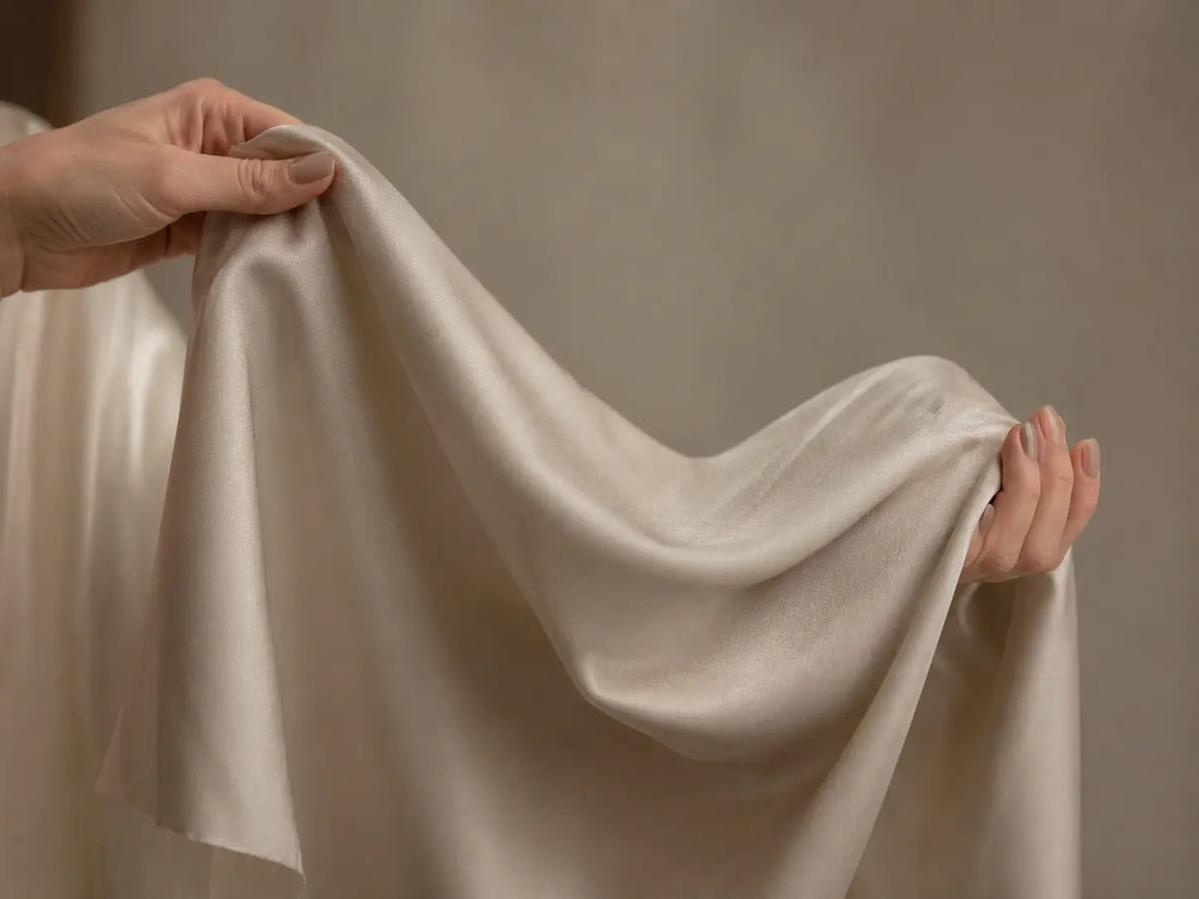 Holding the silk fabric