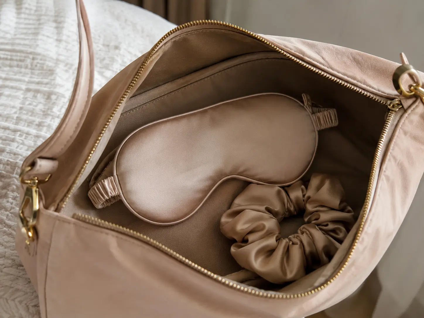 The bag contained a silk eye mask and a silk scrunchie.
